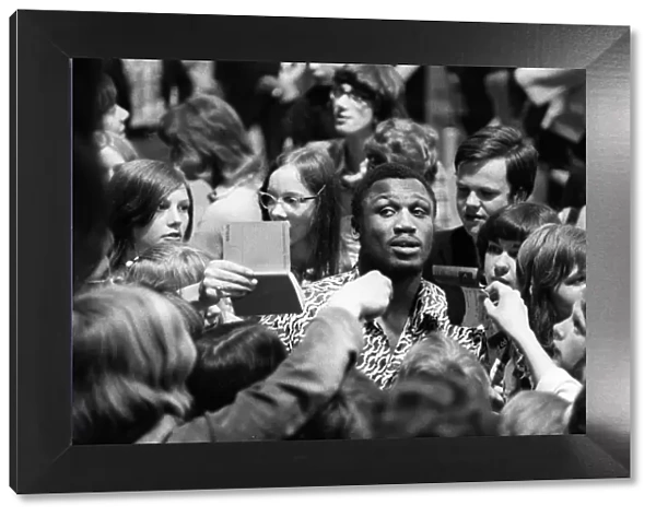 + Heavyweight boxer Joe Frazier of USA during an Autograph session in Berlin in 1971