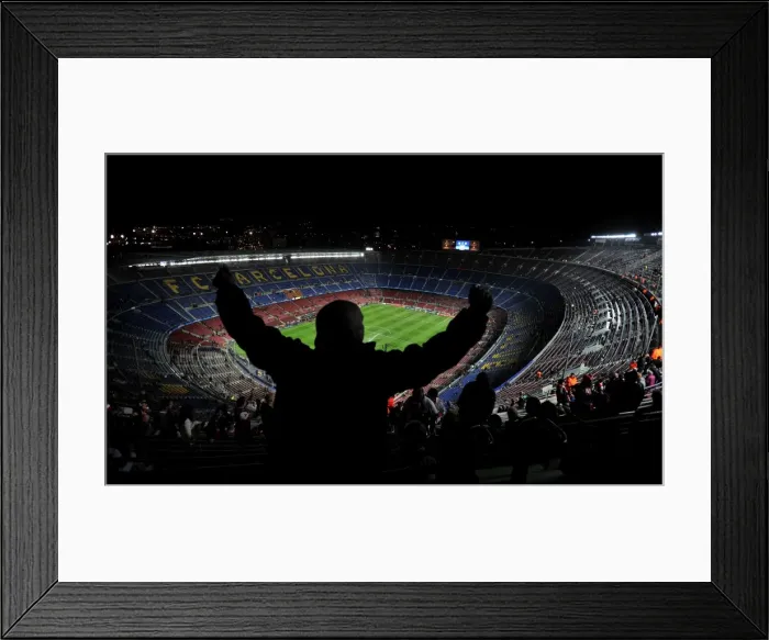 Framed Print : An Arsenal fan sings and dances in the top tier of the Nou Camp before the game against Barcelona