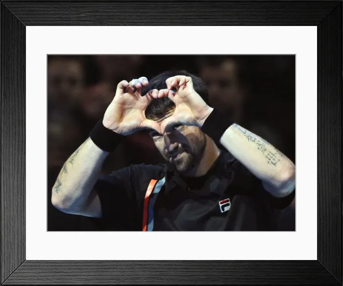 Framed Print : Janko Tipsarevic celebrates victory over Novak Djokovic at the ATP World Tour Finals