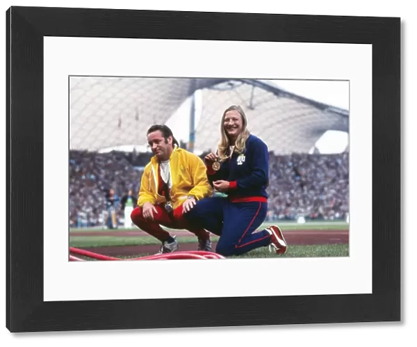 Mary Peters shows off her gold medal with coach Buster McShane at the 1972 Munich Olympics
