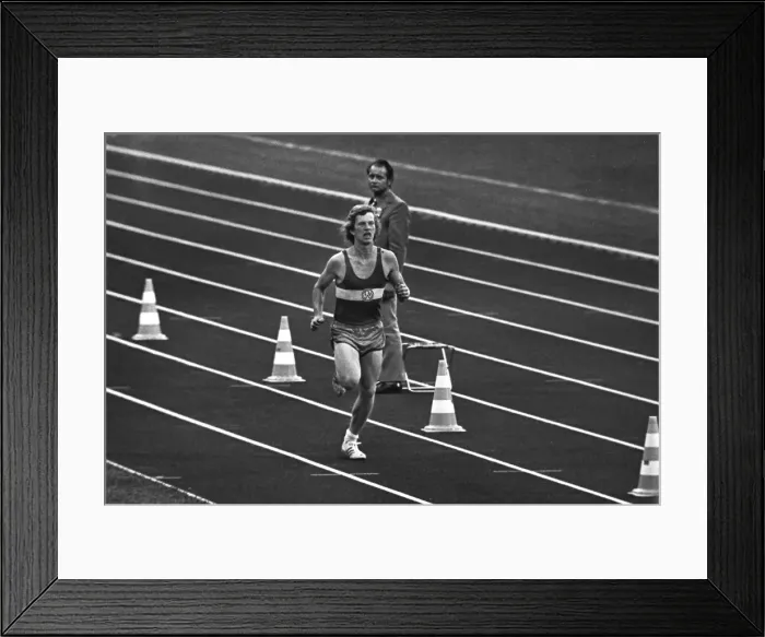 Framed Print : West German student Norbert Sudhaus runs into the stadium as a prank at the end of the marathon at the 1972 Munich Olympics