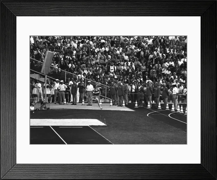Framed Print : West German student Norbert Sudhaus runs into the stadium as a prank at the end of the marathon at the 1972 Munich Olympics Framed Print : West German student Norbert Sudhaus runs into the stadium as a prank at the end of the marathon at the 1972 Munich Olympics