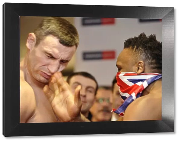 Dereck Chisora slaps Vitali Klitschko at the weigh-in for their world title fight +