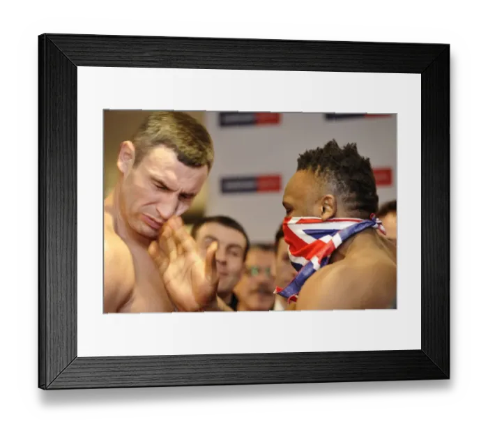 Framed Print : Dereck Chisora slaps Vitali Klitschko at the weigh-in for their world title fight + Framed Print : Dereck Chisora slaps Vitali Klitschko at the weigh-in for their world title fight +