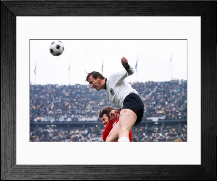 Framed Print : Hans-Georg Schwarzenbeck out-jumps Rodney Marsh in 1972 Framed Print : Hans-Georg Schwarzenbeck out-jumps Rodney Marsh in 1972