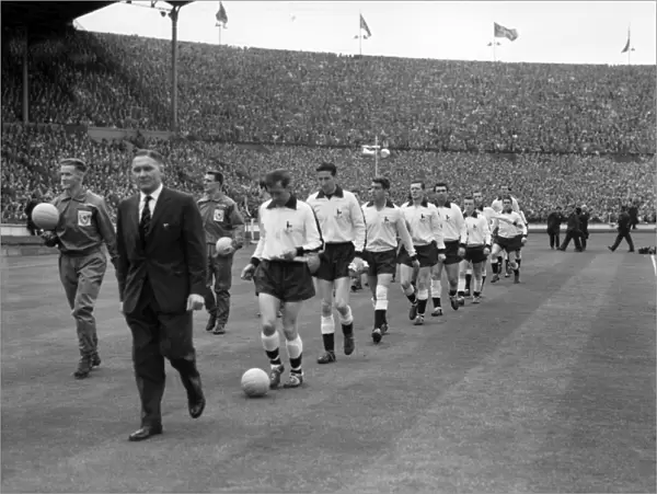 Tottenham Hotspur manager Bill Nicholson leads his Tottenham team onto the pitch for the 1961 FA Cup Final