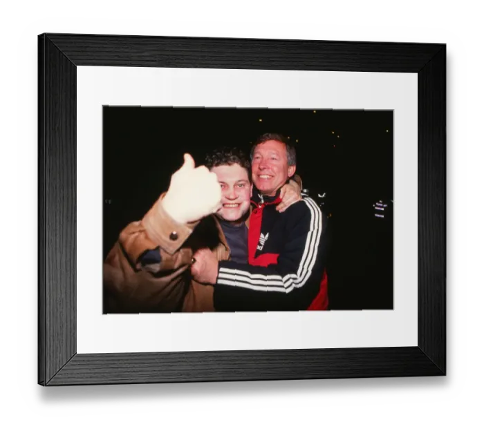 Framed Print : Alex Ferguson celebrates with a fan after Manchester City reach the 1990 FA Cup Final Framed Print : Alex Ferguson celebrates with a fan after Manchester City reach the 1990 FA Cup Final