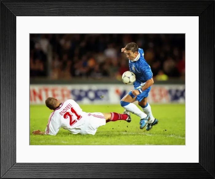 Framed Print : Chelseas Roberto Di Matteo jumps over a tackle from Jochen Endress in the 1998 Cup Winners Cup Final Framed Print : Chelseas Roberto Di Matteo jumps over a tackle from Jochen Endress in the 1998 Cup Winners Cup Final