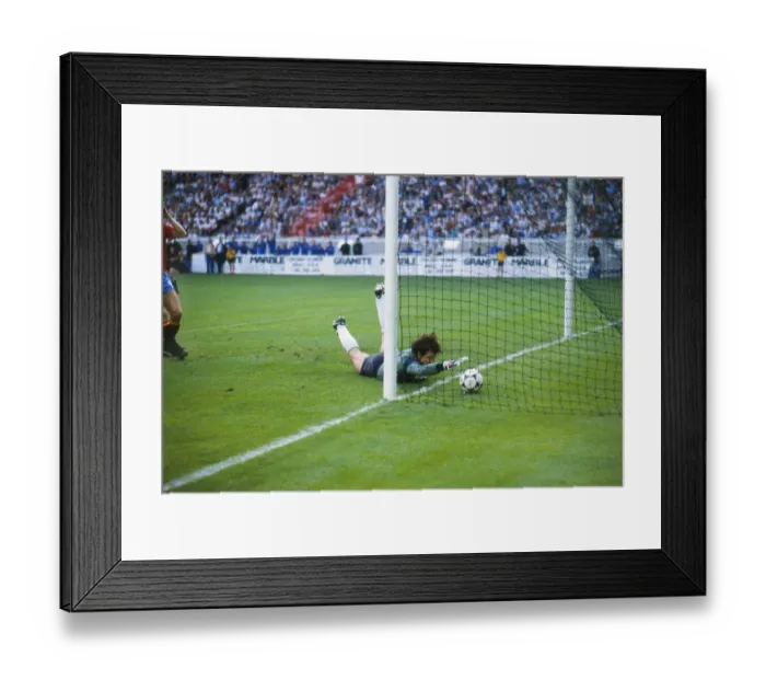 Framed Print : Spain goalkeeper Luis Arconada fumbles the ball into the net from Platinis free-kick in the final of Euro 84 Framed Print : Spain goalkeeper Luis Arconada fumbles the ball into the net from Platinis free-kick in the final of Euro 84