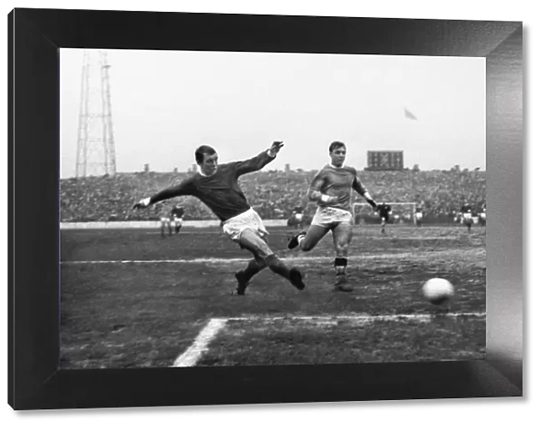 Manchester Uniteds David Herd shoots against Manchester City in 1967