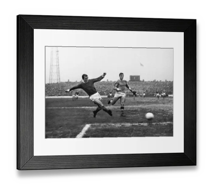 Framed Print : Manchester Uniteds David Herd shoots against Manchester City in 1967 Framed Print : Manchester Uniteds David Herd shoots against Manchester City in 1967