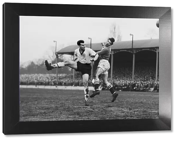 Darlingtons Ken Furphy and Chelseas Ron Tindall jump for a header during the 1958 FA Cup