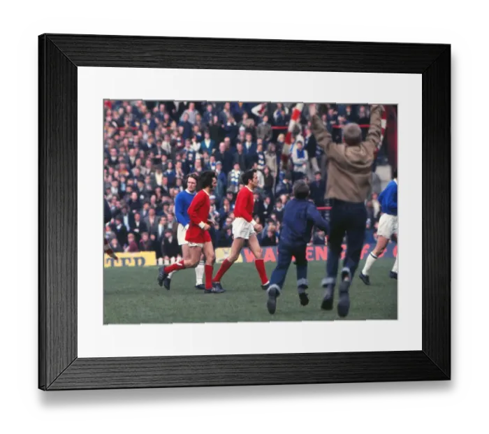 Framed Print : George Best and Shay Brennan run off the Old Trafford pitch after the last game of the 1968 / 9 season Framed Print : George Best and Shay Brennan run off the Old Trafford pitch after the last game of the 1968 / 9 season