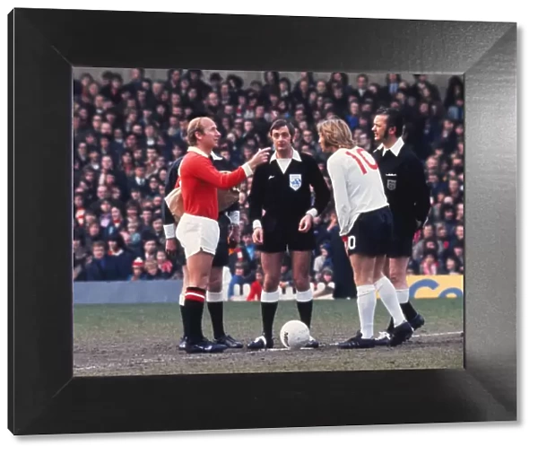 Bobby Charlton tosses the coin before his last home game for Manchester United