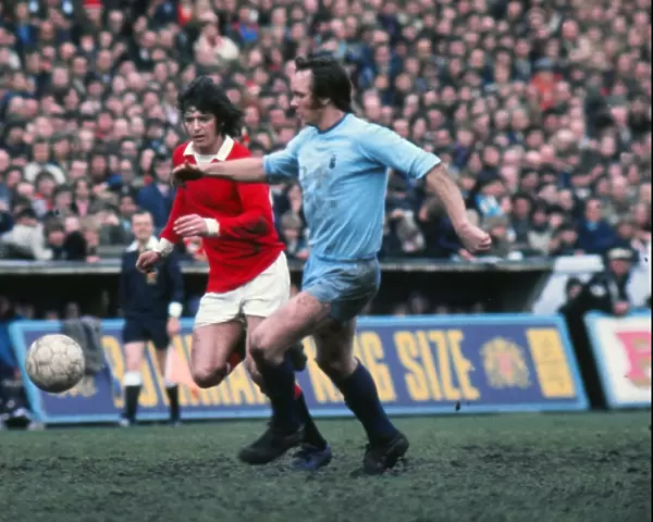 Manchester Uniteds Willie Morgan and Coventrys Roy Barry