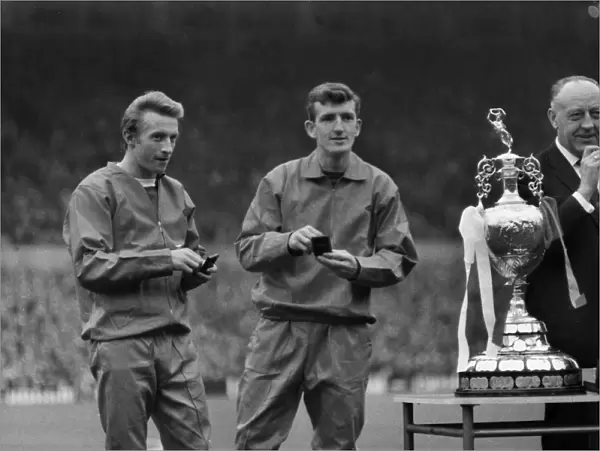 Manchester Uniteds Denis Law and Alex Stepney with their medals at the 1967 League trophy presentation at Old Trafford