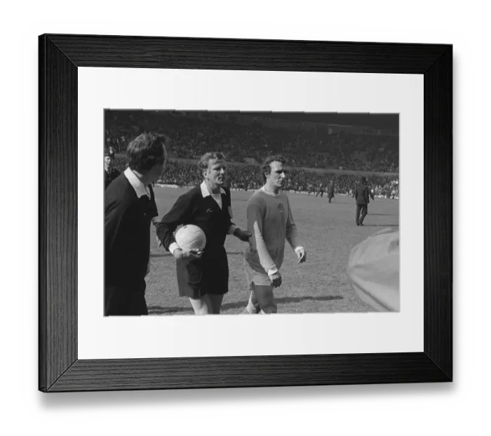 Framed Print : Manchester Citys Mike Summerbee is escorted off the pitch after Manchester United fans invade the field in 1974 Framed Print : Manchester Citys Mike Summerbee is escorted off the pitch after Manchester United fans invade the field in 1974