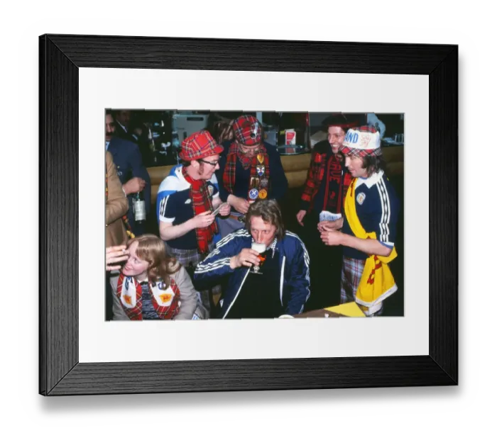 Framed Print : Denis Law has a drink with Scottish fans at the 1978 World Cup Framed Print : Denis Law has a drink with Scottish fans at the 1978 World Cup