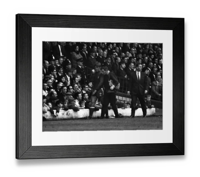 Framed Print : Chelseas David Webb leaves the field with an arm injury at Elland Road in 1969
