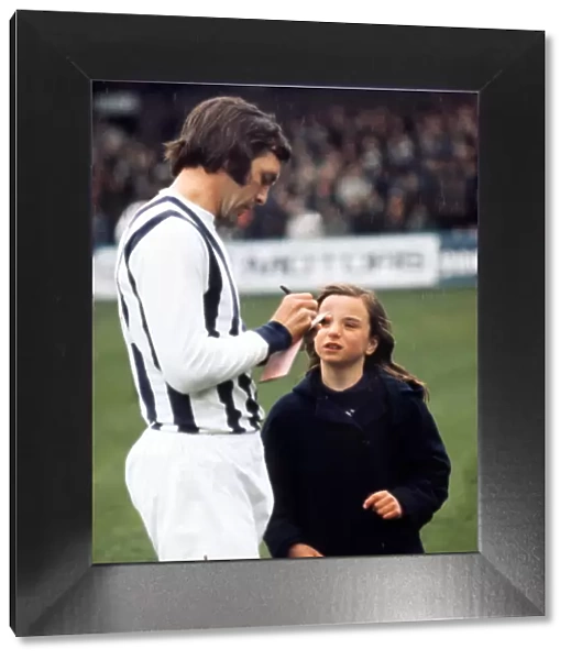 Jeff Astle signs an autograph for a young West Bromwich Albion fan