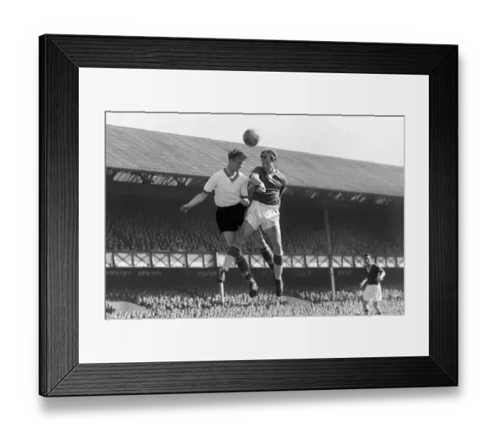 Framed Print : Evertons James Harris and Leeds Jack Charlton compete for a header Framed Print : Evertons James Harris and Leeds Jack Charlton compete for a header