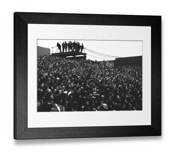 Framed Print : A young fan is passed over the heads of fans in the Clock End at Highbury during the 1973 FA Cup Framed Print : A young fan is passed over the heads of fans in the Clock End at Highbury during the 1973 FA Cup