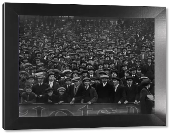 Fans in flat caps in the stands at St Andrews in 1922