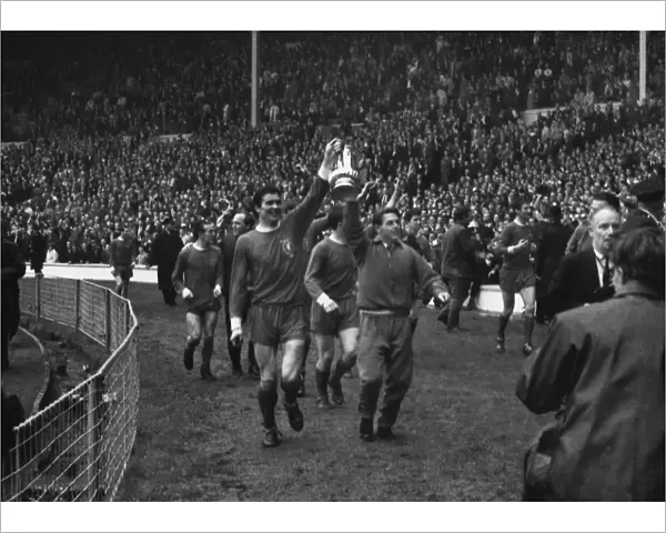 Captain Ron Yeats and teammate Gordon Milne parade the trophy after Liverpools 1965 FA Cup victory