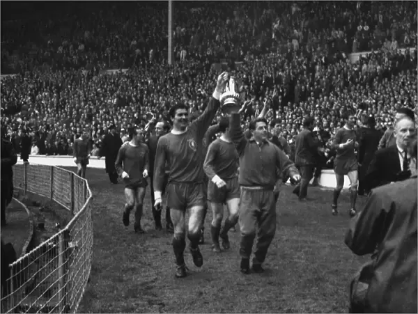 Captain Ron Yeats and teammate Gordon Milne parade the trophy after Liverpools 1965 FA Cup victory