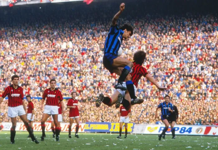 Framed Print : Alessandro Altobelli and Mark Hateley compete in the air during the Milan Derby in 1984