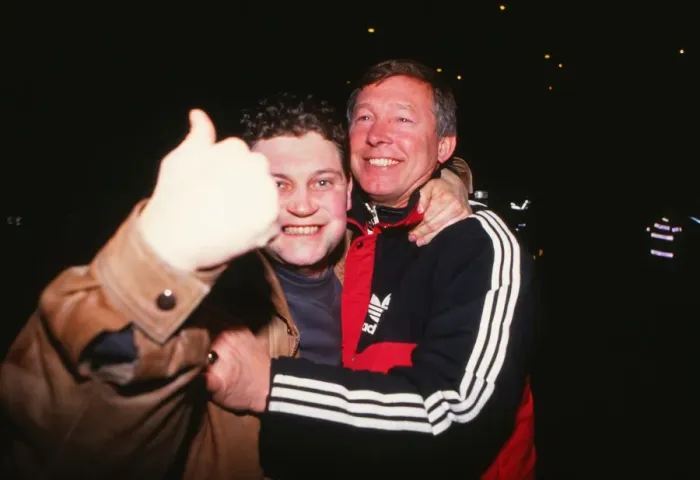 Framed Print : Alex Ferguson celebrates with a fan after Manchester City reach the 1990 FA Cup Final Framed Print : Alex Ferguson celebrates with a fan after Manchester City reach the 1990 FA Cup Final