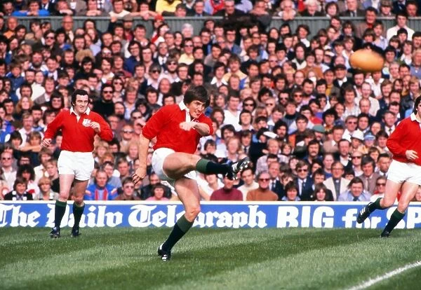 Andy Irvine kicks for the British Lions against the Barbarians in 1977
