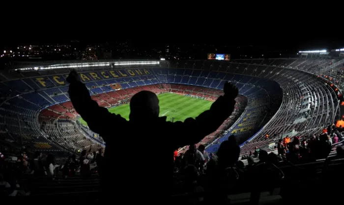 Framed Print : An Arsenal fan sings and dances in the top tier of the Nou Camp before the game against Barcelona