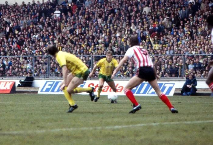 Framed Print : Asa Hartfords shot deflects off Gordon Chisholm for an own goal - 1985 League Cup Final