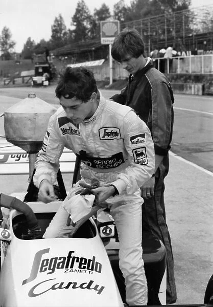 Ayrton Senna gets into his Toleman-Hart Car during practice for the 1984 British Grand Prix Practice