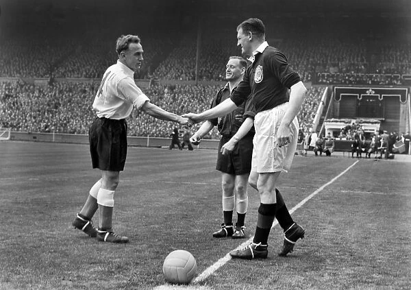 The two captains, Englands Billy Wright, and Scotlands George Young, shake hands before kick-off - 1952  /  3 British Home Championship
