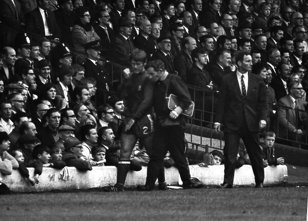 Chelseas David Webb leaves the field with an arm injury at Elland Road in 1969