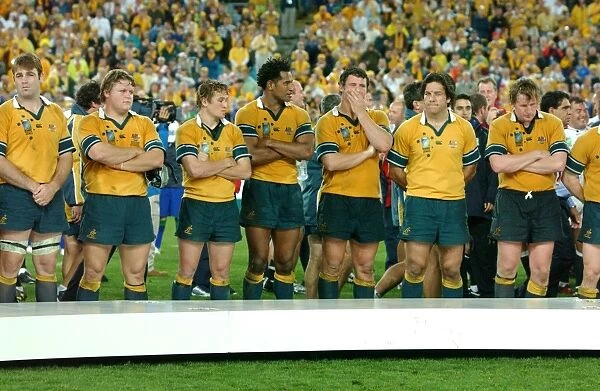 Dejected Australian players line up to receive their losers medals