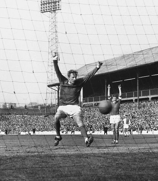 Denis Law celebrates a Manchester United goal in 1965