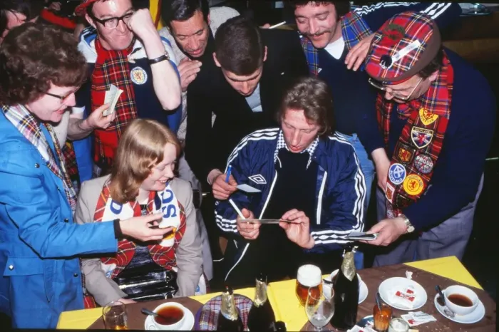 Framed Print : Denis Law signs autographs for Scottish fans at a bar at the 1978 World Cup Framed Print : Denis Law signs autographs for Scottish fans at a bar at the 1978 World Cup