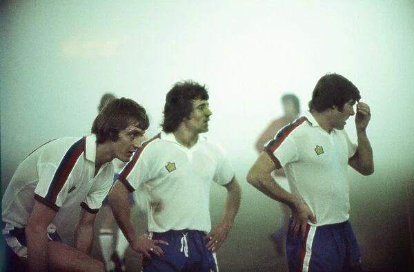 England players Allan Clarke, Kevin Keegan and Malcolm MacDonald in the fog during the abandoned game against Czechoslovakia in 1975