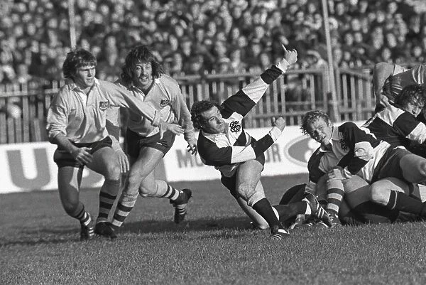 Gareth Edwards passes the ball away for the Barbarians in 1976