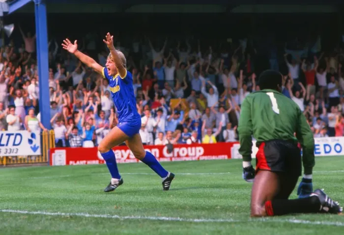 Framed Print : Glyn Hodges of Wimbledon celebrates scoring against Man City in 1984 Framed Print : Glyn Hodges of Wimbledon celebrates scoring against Man City in 1984