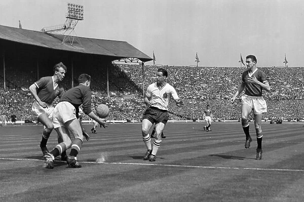Harry Gregg fields the ball under pressure from Nat Lofthouse in the 1958 FA Cup Final