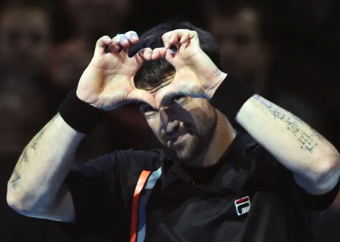Framed Print : Janko Tipsarevic celebrates victory over Novak Djokovic at the ATP World Tour Finals