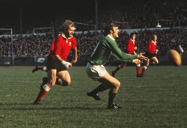 John Taylor puts pressure on John Moloney during the 1973 Five Nations
