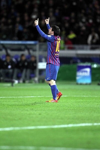 Lionel Messi celebrates scoring in the 2011 Club World Cup Final