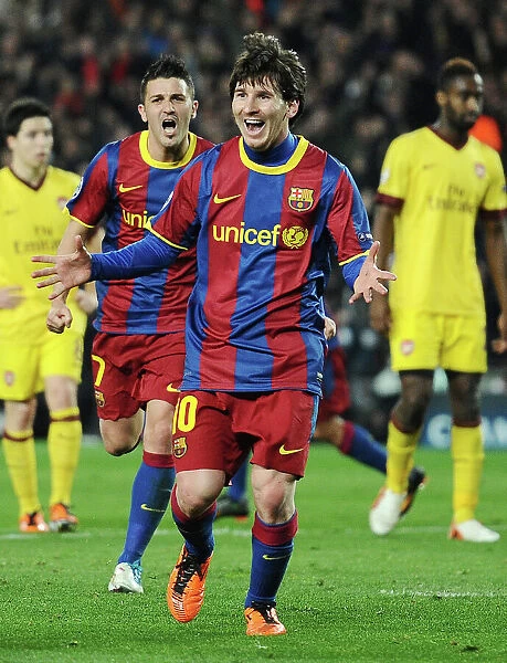 Lionel Messi and David Villa celebrate