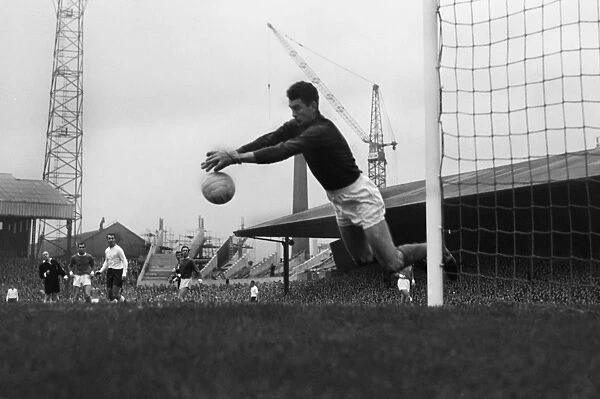 Manchester United goalkeeper Patrick Dunne makes a save at Old Trafford