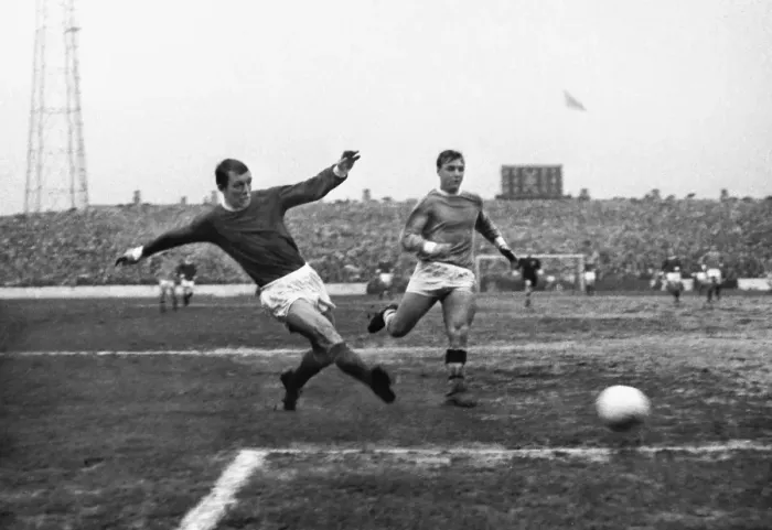 Framed Print : Manchester Uniteds David Herd shoots against Manchester City in 1967 Framed Print : Manchester Uniteds David Herd shoots against Manchester City in 1967